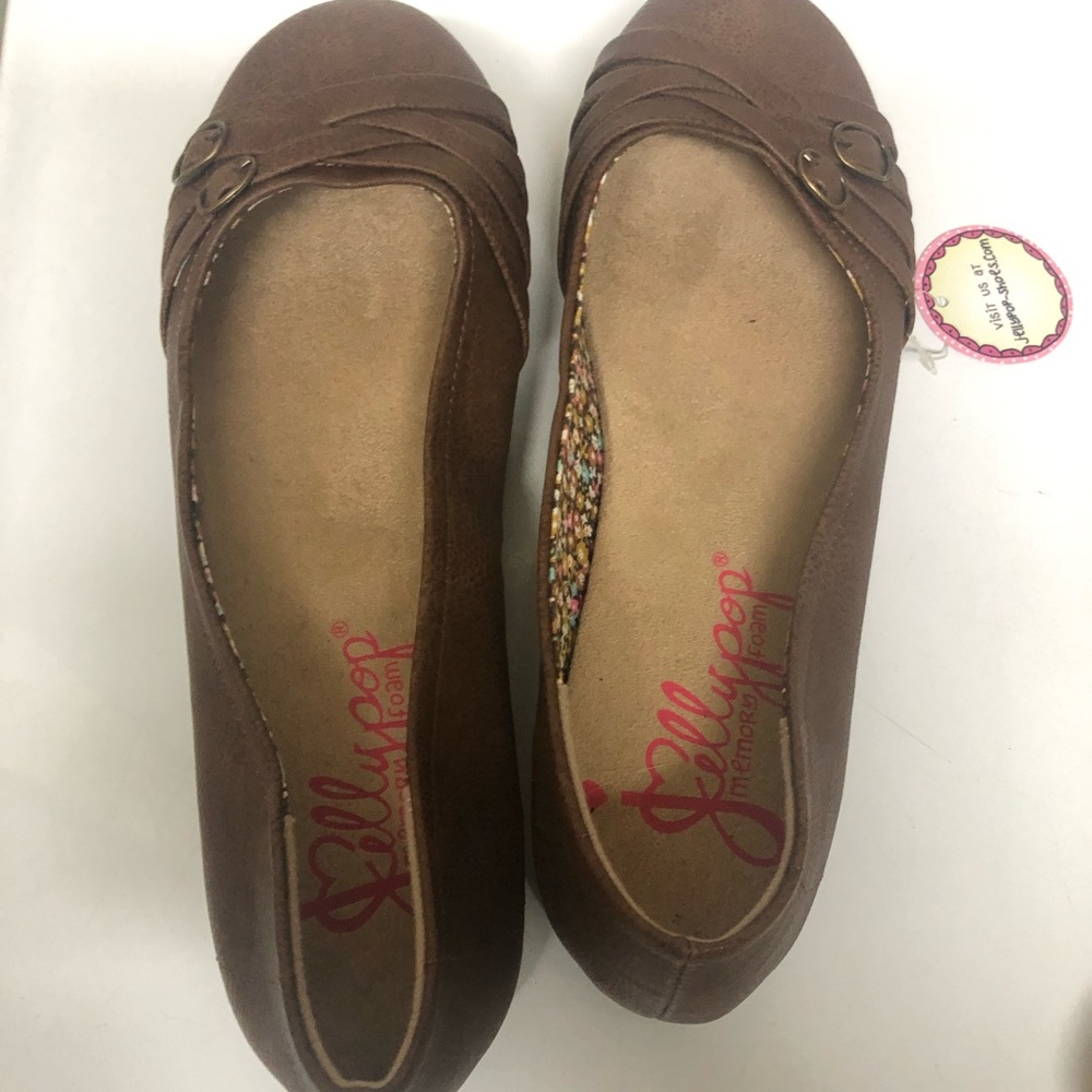 NWT Brown flat shoes.